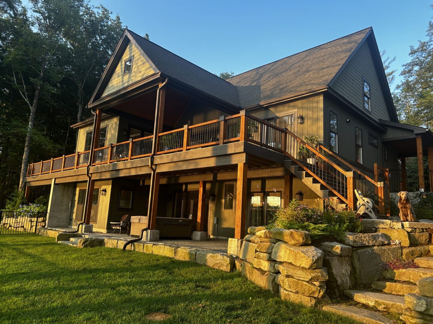 A large wooden house with stairs going up to the top.